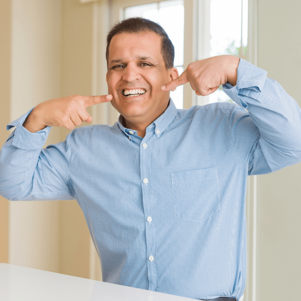 A man showing off his white smile